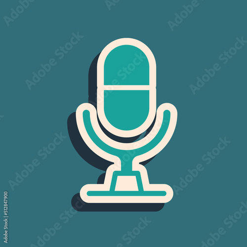 Green Microphone voice device icon isolated on green background. Microphone interpreter and alphabet letters. Long shadow style. Vector