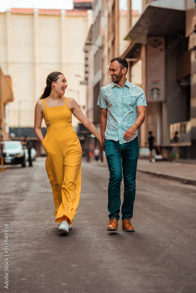 beautiful couple walking while holding hands