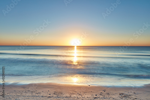 Fototapeta Naklejka Na Ścianę i Meble -  Beautiful copyspace west coast of Jutland in Denmark. Ocean waves washing onto the shore at beach in resort. Water and seascape during holiday and vacation abroad and overseas. View of sea during day