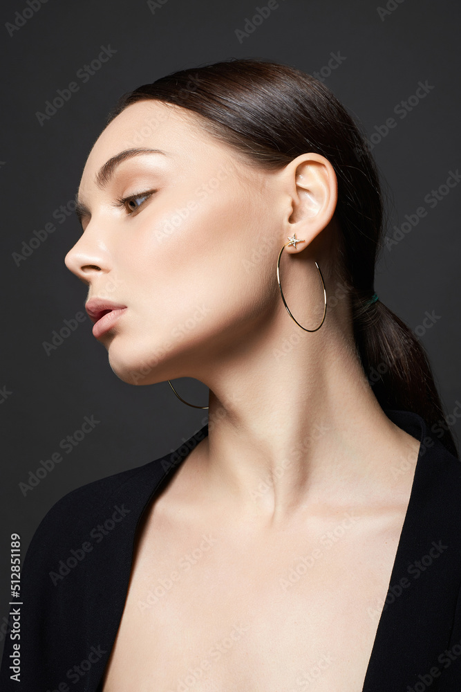 Fototapeta premium Beautiful young woman with jewelry