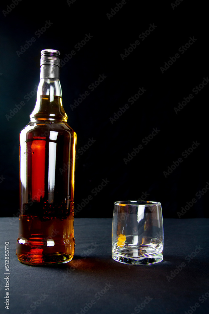 A strong amber whiskey on a black background. Scotch Whisky A strong amber whiskey on a black background. Scotch Whisky