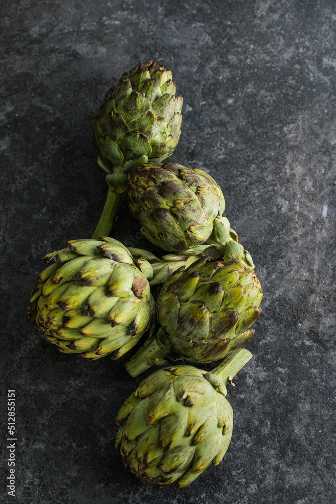 Fresh Artichoke on black background. Raw Artichok closeup Fresh Artichoke on black background. Raw Artichok closeup