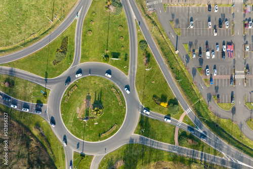 canvas print motiv - bilanol : Aerial view of road roundabout intersection with moving heavy traffic. Urban circular transportation crossroads