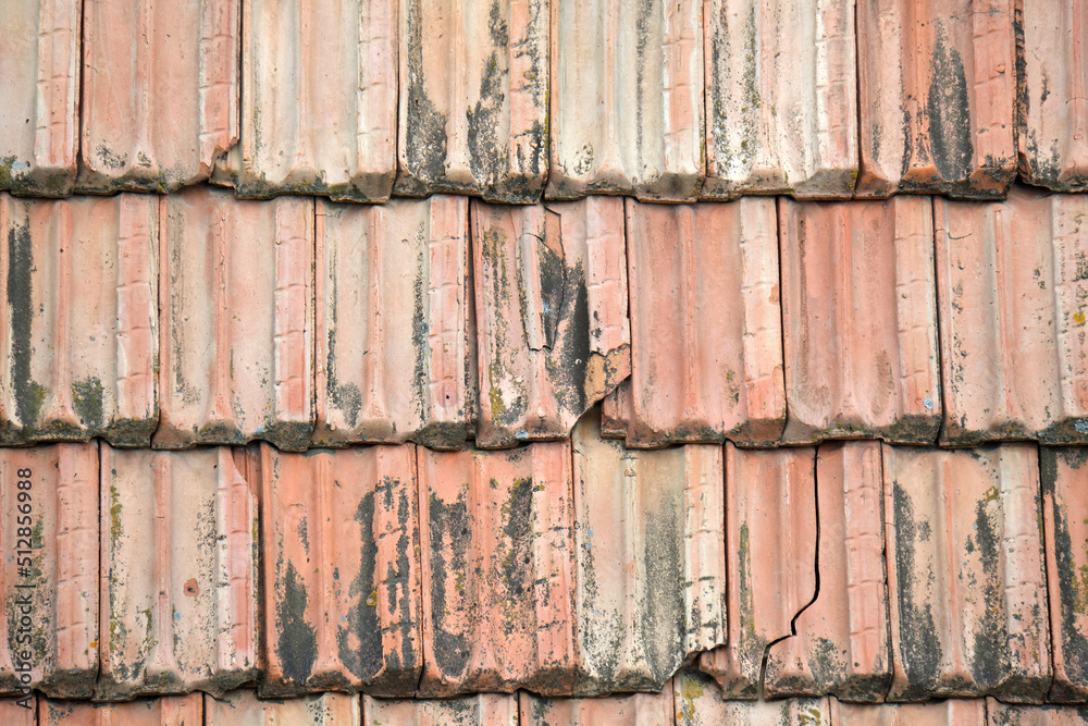 Closeup surface of old weathered ceramic tiles covering building roof