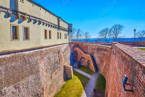 The deep moat and high impregnable wall of Spilberk fortress in Brno, Czech Republic