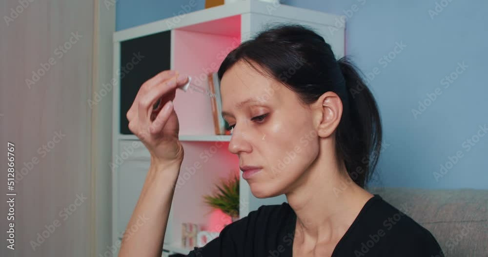 Woman doing face massage with oil after applied face mask. Beauty skin care and Anti age and lifting at home Woman doing face massage with oil after applied face mask. Beauty skin care and Anti age and lifting at home