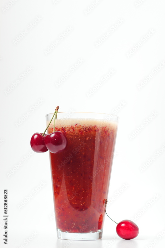 cherry drink and bunch of cherries on white background, cold drink, space for text cherry drink and bunch of cherries on white background, cold drink, space for text