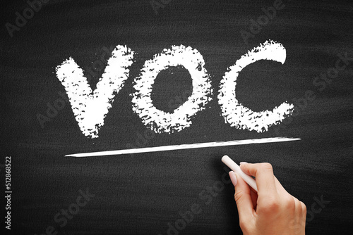 VOC - Volatile Organic Compound are organic chemicals that have a high vapour pressure at room temperature, acronym concept on blackboard photo