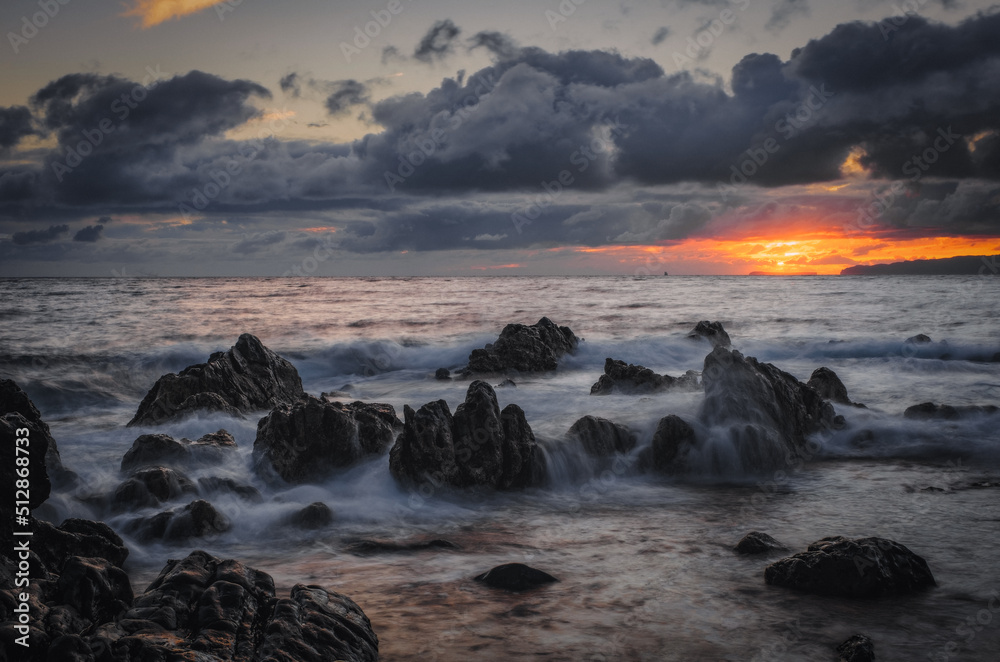 Obraz premium Sunrise on Reis Magos beach. Canico, Madeira, Portugal. October 2021. Long exposure picture