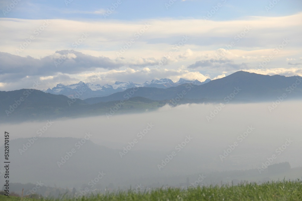 Morning fog with the alps in the background