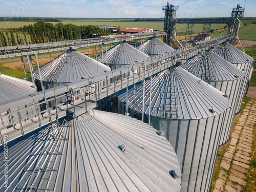 Granary elevator for export wheat, Silos agro plant for processing drying cleaning, storage of agricultural products grain. Large iron terminal of grain photo