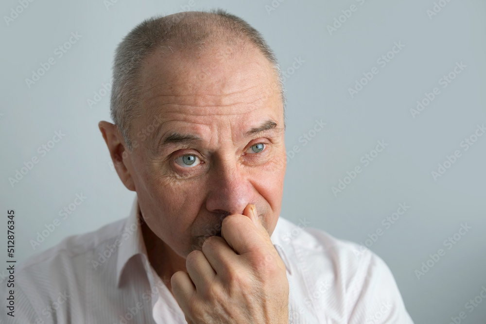 close-up of mature charismatic man, senior 60 years surprised, puzzled, shocked by news, event, bright facial expressions, overhang, concept human health, mood, human stress resistance close-up of mature charismatic man, senior 60 years surprised, puzzled, shocked by news, event, bright facial expressions, overhang, concept human health, mood, human stress resistance