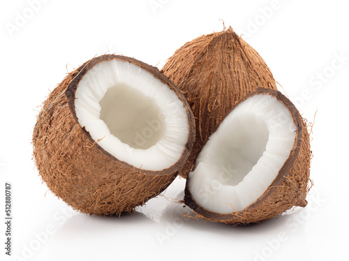 Ripe coconut broken into two halves closeup on white background