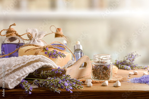 Natural lavender body care products on wooden table