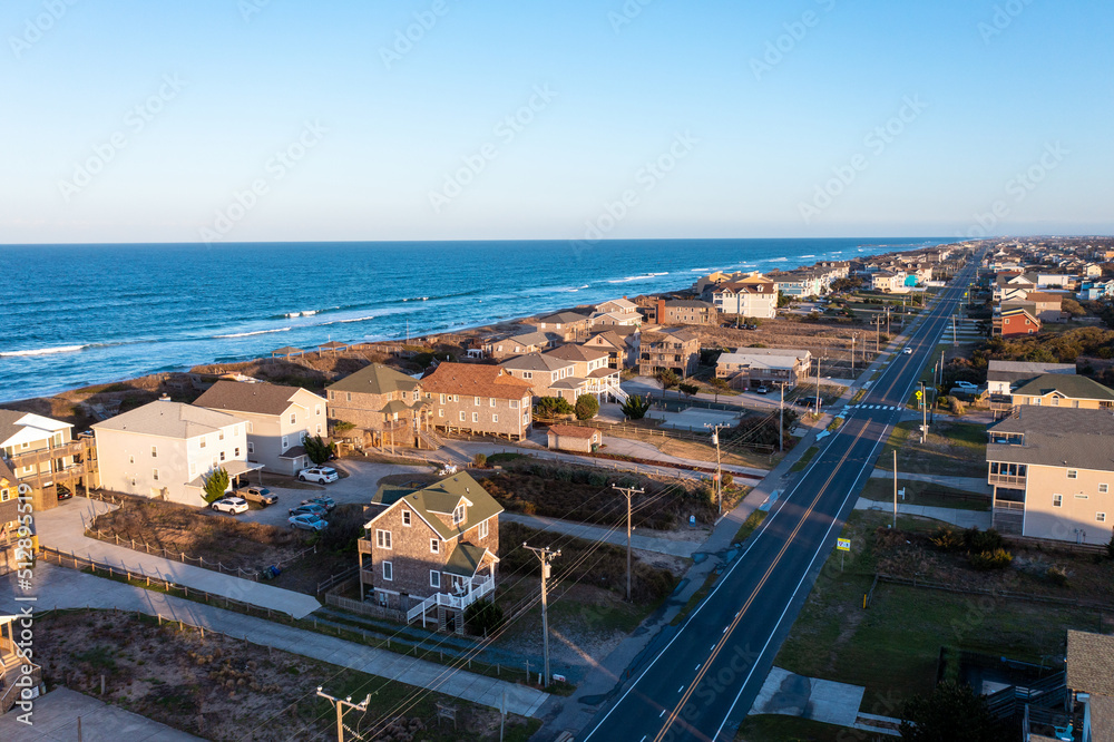Obraz premium Aerial View of homes and the beach during golden hour in Nags Head North Carolina