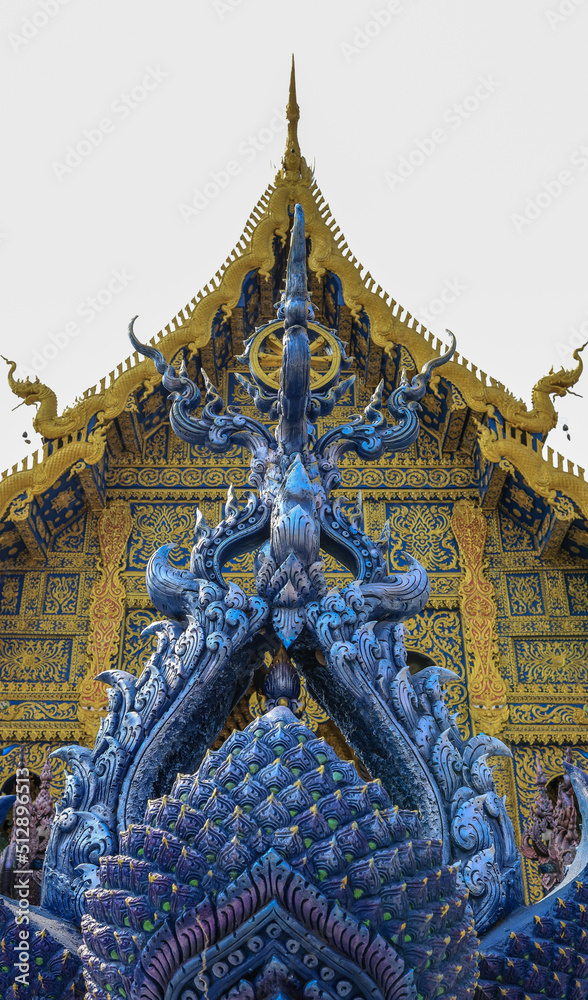 Fototapeta premium Chiang Rai Province,Northern Thailand on January 19,2020:Beautiful artworks at the main hall’s entrance of Wat Rong Suea Ten or Blue Temple.
