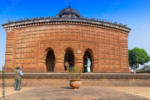 BISHNUPUR, WEST BENGAL / INDIA - DECEMBER 26, 2015 : Famous terracotta (fired clay of a brownish-red colour, used as ornamental building material) artworks at Madanmohan Temple, UNESCO heritage site. photo