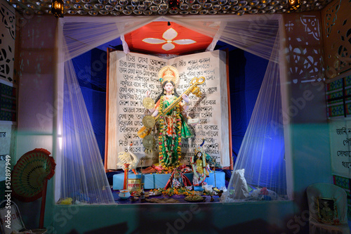 Obraz na płótnie Howrah, West Bengal, India - 17th February 2021 : Beautifully decorated pandal, at night, to worship Goddess Saraswati. Hindu goddess of knowledge, music, art, wisdom, and learning. w salonie