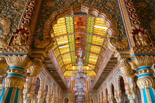 Mysore, Karnataka, India - November 25th 2018 : Beautiful decorated interior ceiling of the Private Durbar Hall, called Diwan-E-Khas, inside the royal Mysore Palace. Gold used on gilded ceiling. photo