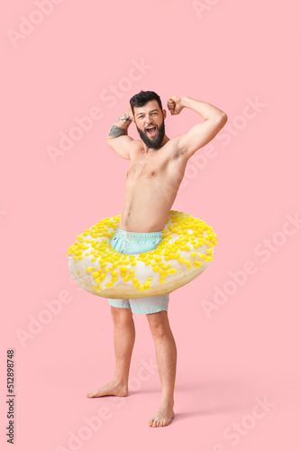 Funny young man with big do...