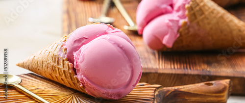 Tasty strawberry ice cream on table, closeup