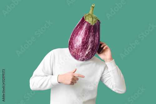 Man with fresh eggplant ins...
