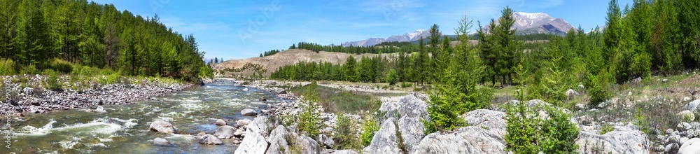 Beautiful panoramic landscape of the mountain river Irkut with rocky banks and green forest. Tourist tents in the forest. Rest at nature. Natural summer background, banner Beautiful panoramic landscape of the mountain river Irkut with rocky banks and green forest. Tourist tents in the forest. Rest at nature. Natural summer background, banner