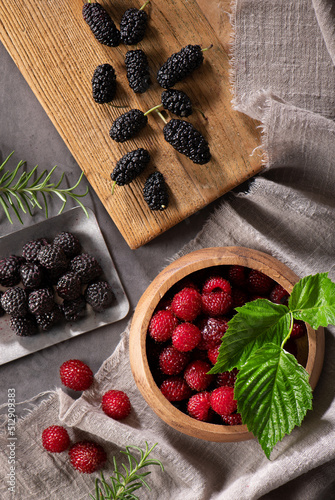 Image decorated with raspberries, black berry and mulberry photo