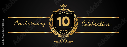 10 years anniversary celebration logotype with golden laurel and wreath vector. Anniversary celebration template design for booklet, brochure, leaflet, magazine, birthday party, banner, greeting.