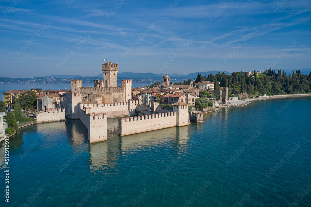 Scaligero Castle drone view. Sirmione top view. Aerial view of Sirmione, an ancient village on southern Garda Lake. Popular travel destination on Lake Garda in Italy.