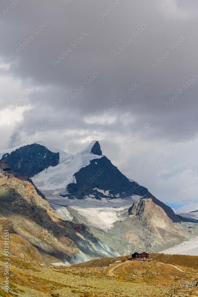 Beautiful cloudscape in the Swiss Alps in summer, with Matterhorn peak in the background