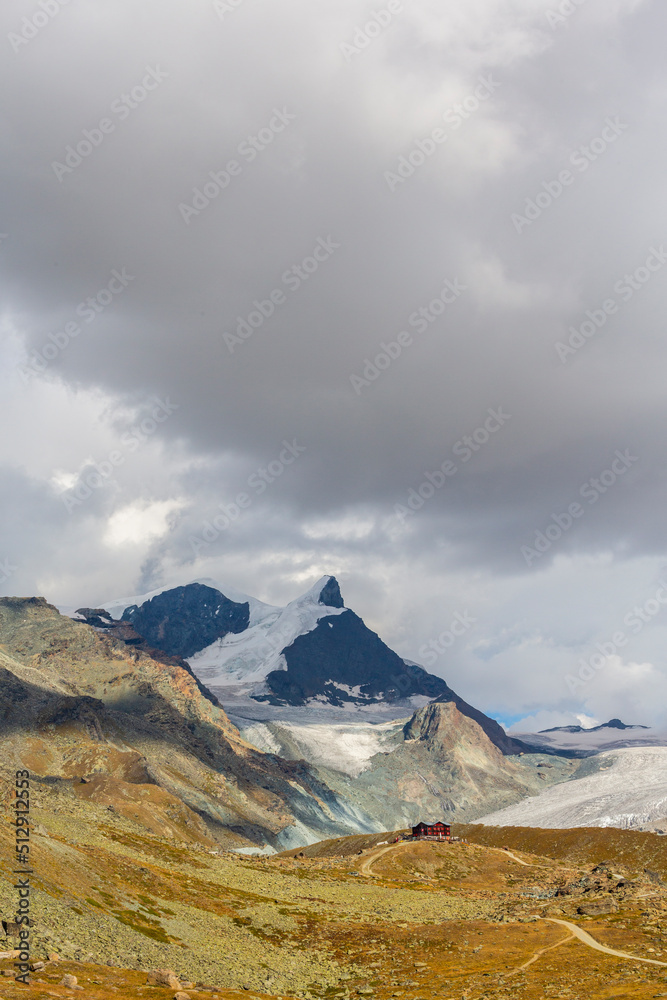 Beautiful cloudscape in the Swiss Alps in summer, with Matterhorn peak in the background