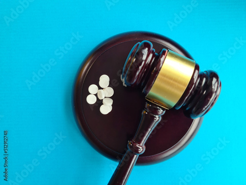 Judge gavel and pills. Litigation related to pharmaceuticals and law in medicine photo