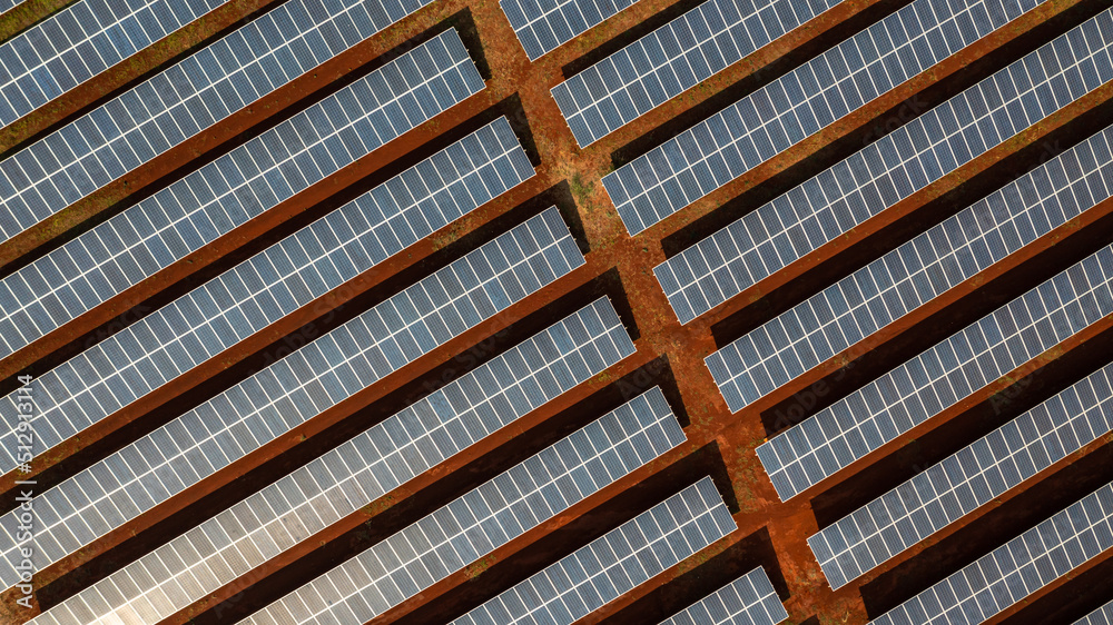Aerial top view solar panels solar cell in solar farm and sun lighting reflect, Aerial view photovoltaic plant field. Aerial top view solar panels solar cell in solar farm and sun lighting reflect, Aerial view photovoltaic plant field.