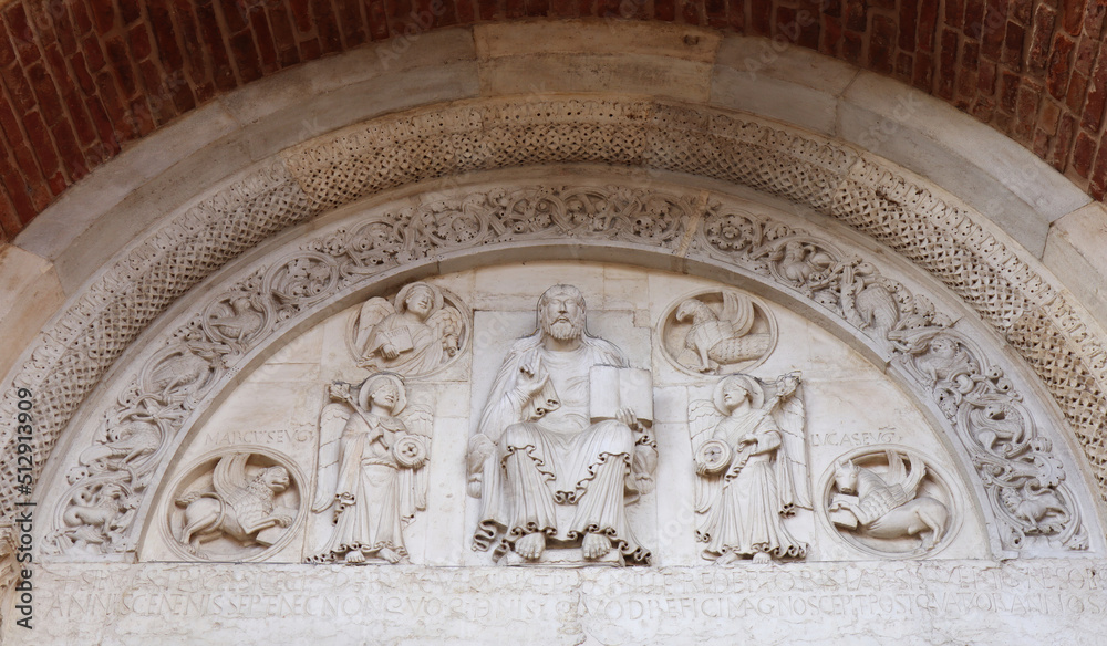 Lunette by Wiligelmo at the main entrance of the Abbey of Nonantola, Abbazia di Nonantola. Modena, Italy