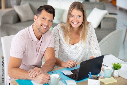 couple using laptop in the living room