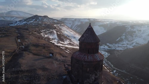 Kars, Turkey - February 23, 2022: Aerial drone footage of Saint Gregory church with a bird on top of it at Ani ancient city Kars Turkey photo