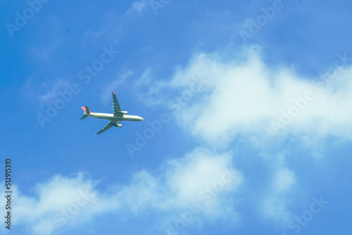 Soft focus shows the movement of an airplane flying in the sky.