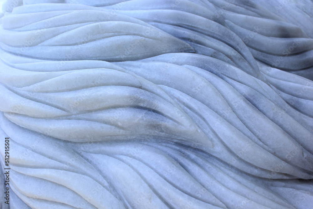 Marble surface is carved with swaying patterns. Marble surface is carved with swaying patterns.