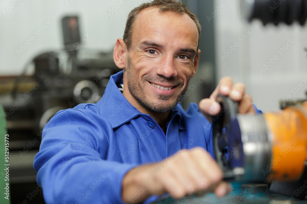 happy man around the milling machine at factory