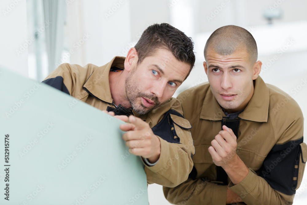 focused young man learning in carpenting studio focused young man learning in carpenting studio
