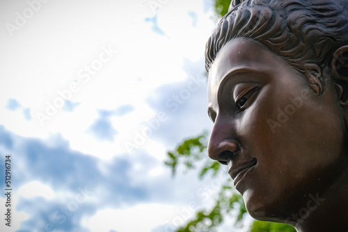 Buddha statues in various gestures at the Bodhi tree courtyard in Wat Benchamabophit. photo