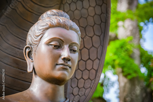 Buddha statues in various gestures at the Bodhi tree courtyard in Wat Benchamabophit. photo