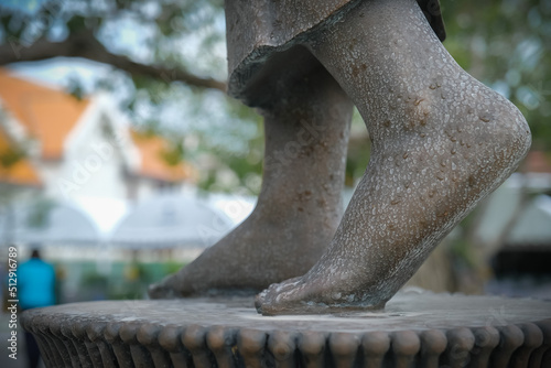 Buddha statues in various gestures at the Bodhi tree courtyard in Wat Benchamabophit. photo