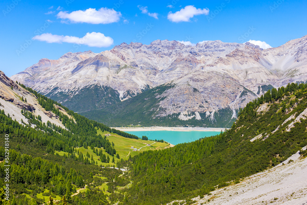 Obraz premium View of beautiful lakes San Giacomo and Cancano in Alpisella valley on sunny summer day, Alps Mountains, Italy