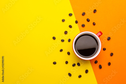 Top view black coffee or Americano in red cup isolated on yellow