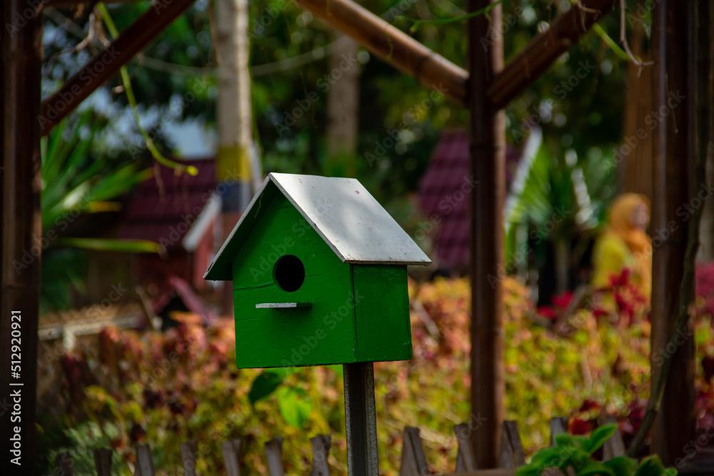 The bird house that is located The bird house that is located
