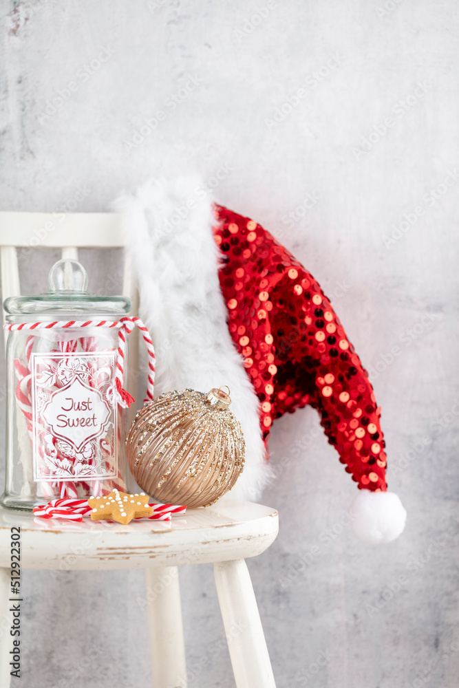 Obraz premium Christmas Decoration, Santa Claus Hat And Wooden Chair.