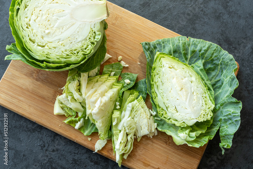 Chopped young fresh cabbage on a kitchen board