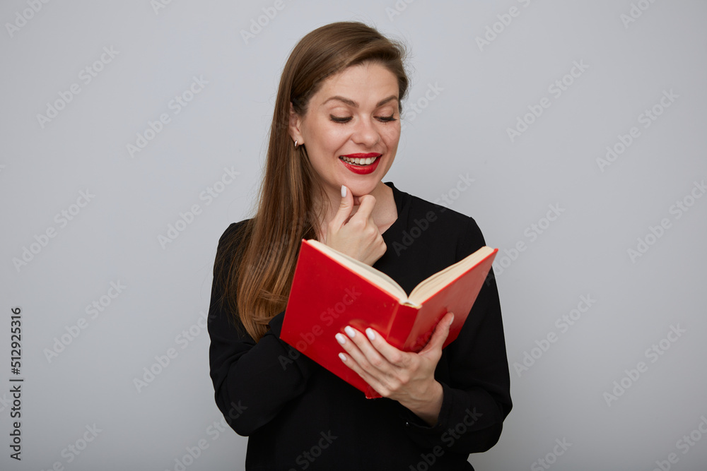 Teacher woman in black suit holding open red book. Isolated portrait of adult student. Teacher woman in black suit holding open red book. Isolated portrait of adult student.